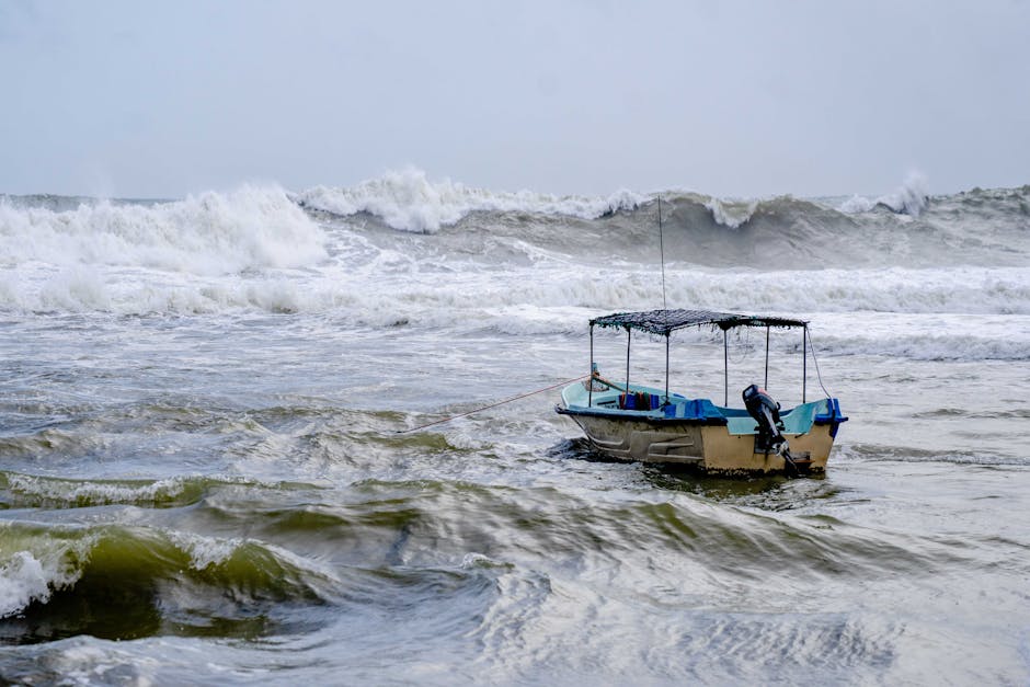 Person on a boat looking at rough sea waves
