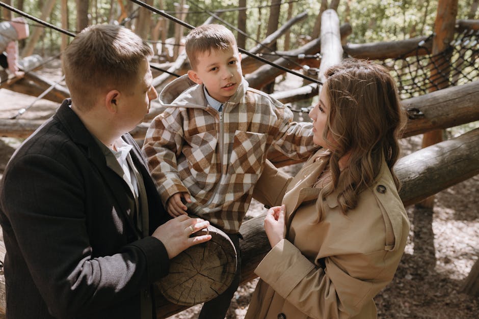 Preschool child seeking attention from mother while father is nearby