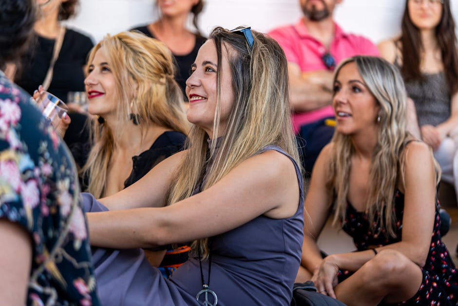 Group of people in a lively social gathering talking and laughing