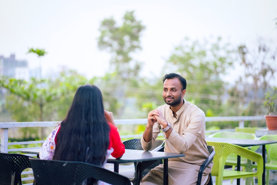 Two people having a thoughtful conversation in a cafe
