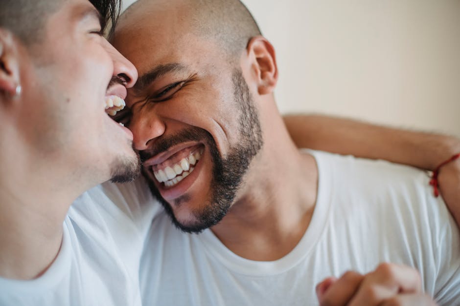 Couple laughing together in a warm, candid moment