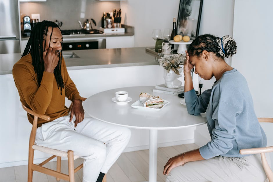 Two people in a tense conversation with one appearing opportunistic