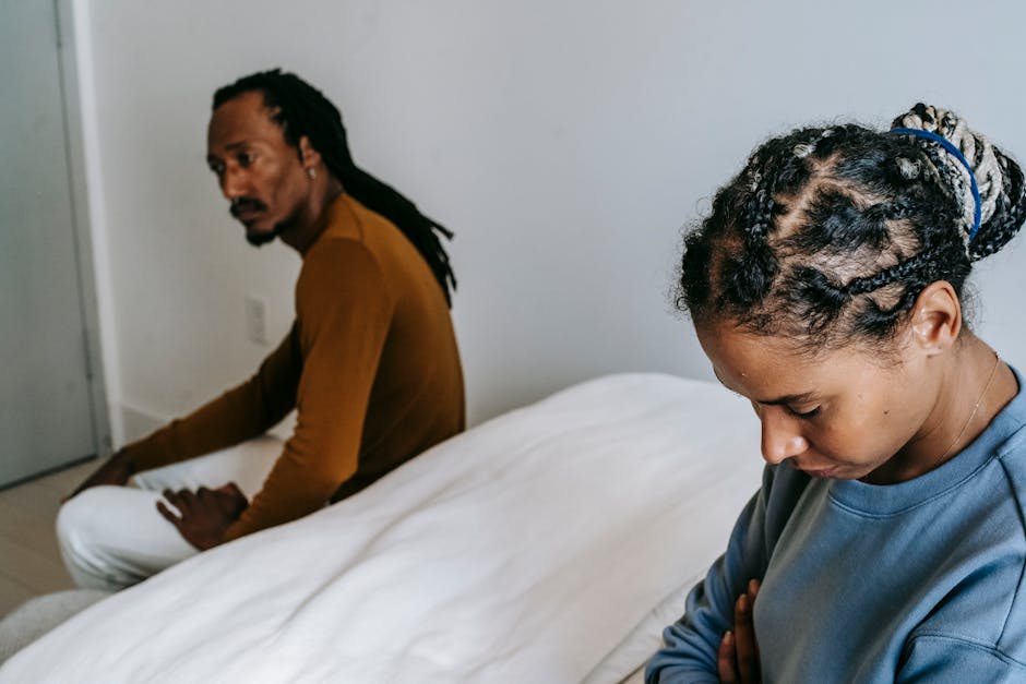 Couple in conflict with one person looking criticized and emotionally hurt