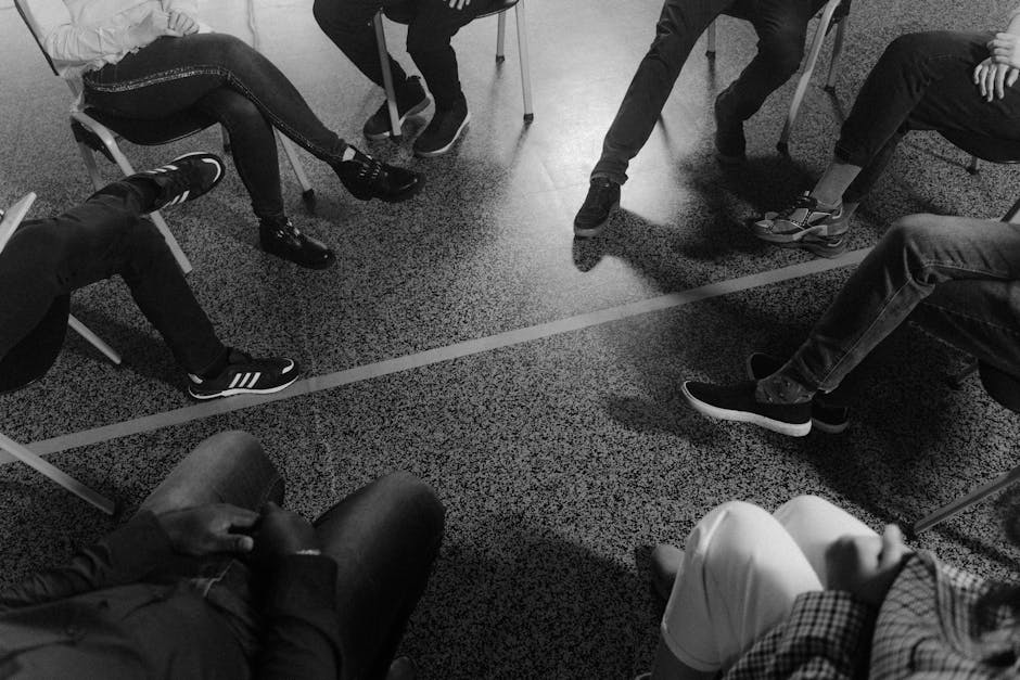 Supportive group therapy session with people talking