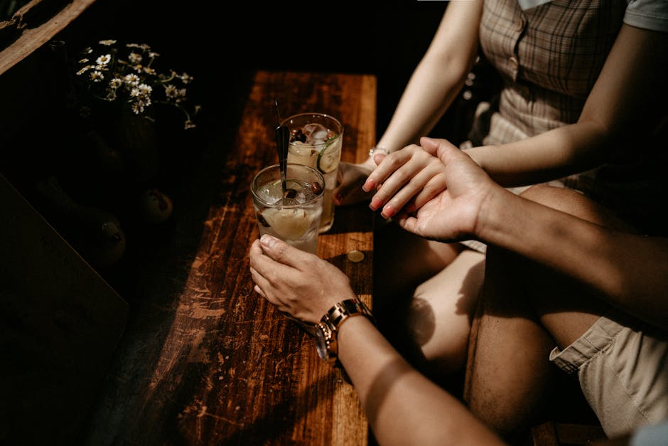 Two people holding hands in a warm intimate moment