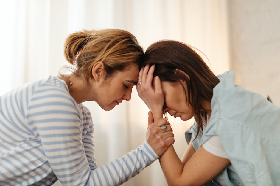 Person holding hands with a trusted friend during a stressful moment