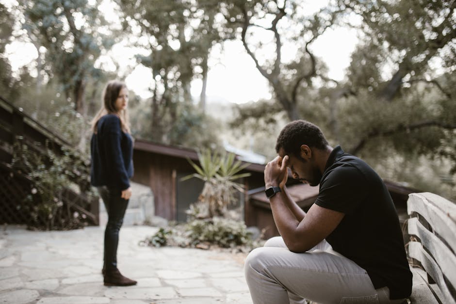 Couple with emotional distance and tension, one person looking away