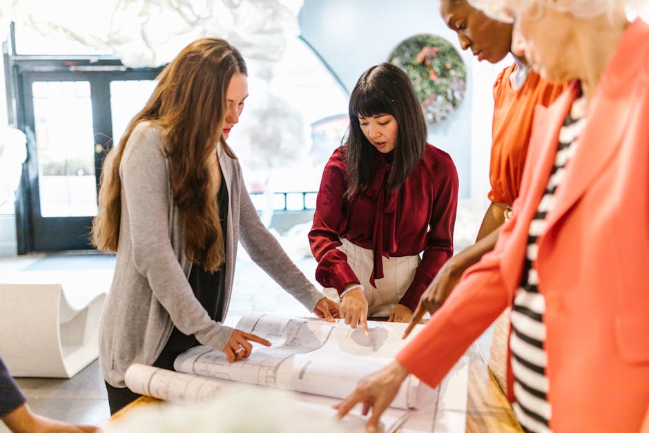 Diverse team collaborating in an office meeting with one person leading discussion
