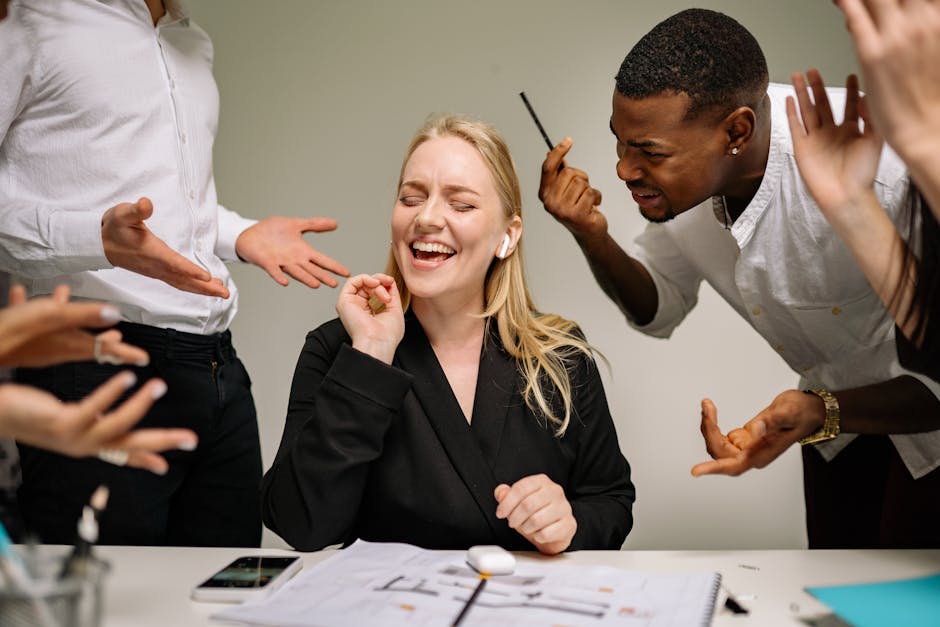Two coworkers in a tense conversation with one giving a silent treatment