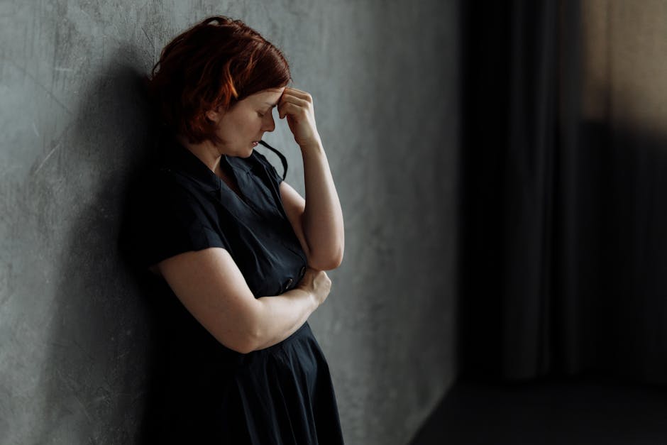 Person sitting alone in deep thought, emotional stress and resentment