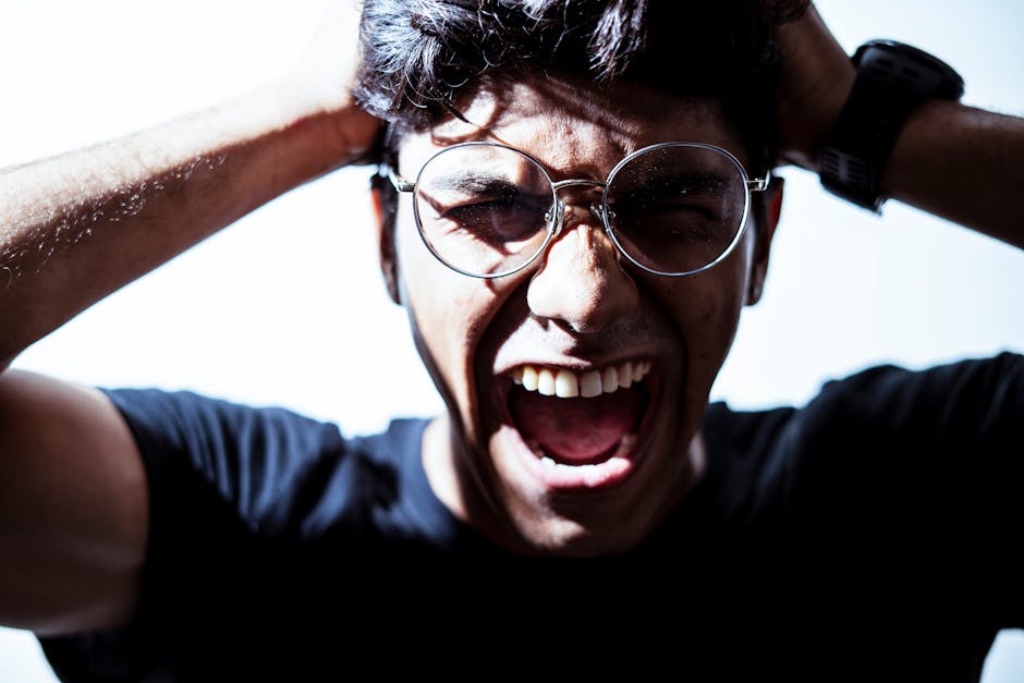 Person experiencing intense anger and frustration in a tense moment
