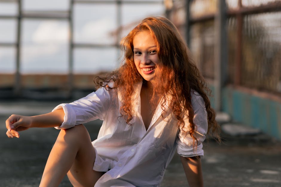 Person smiling in warm sunlight outdoors