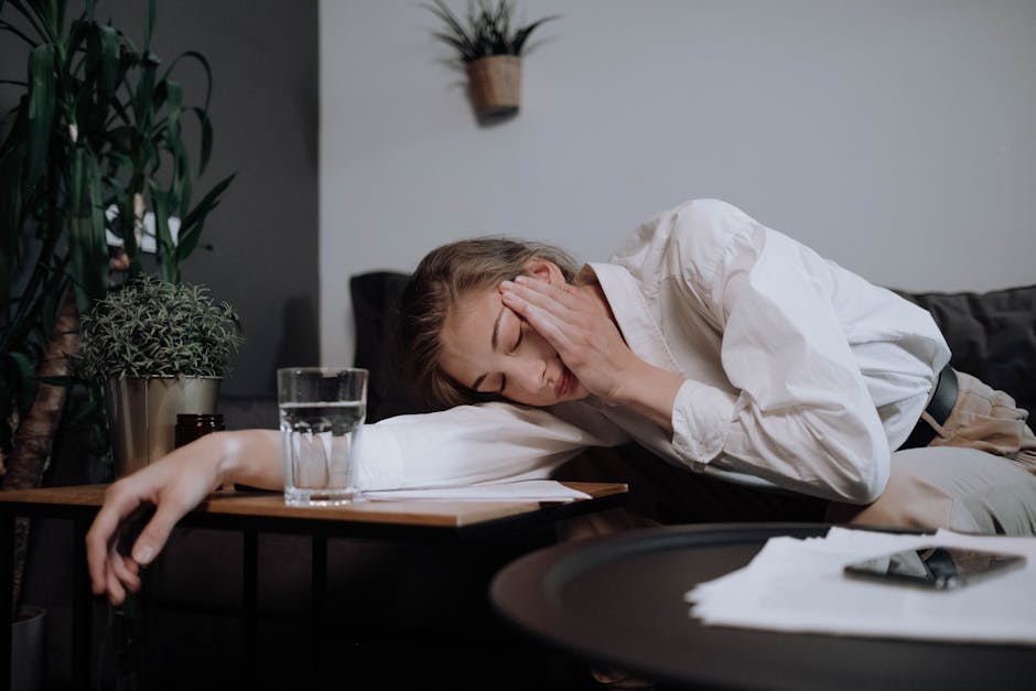 Person resting alone after an emotionally intense day, symbolizing compassion fatigue and emotional overload