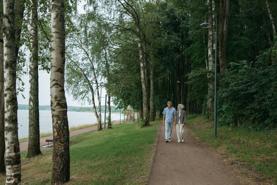 Happy long-term couple walking together outdoors, illustrating companionate love and commitment