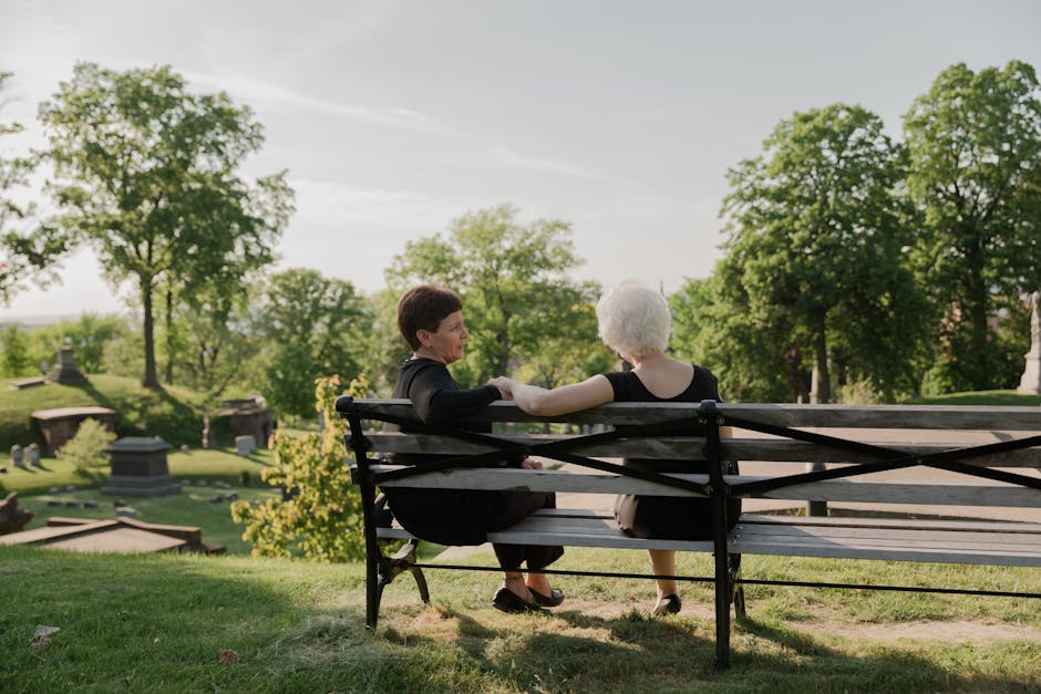 Close-up of a person sitting quietly beside someone in distress