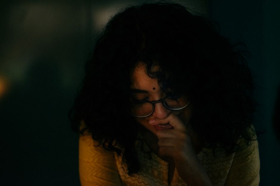 Young woman looking thoughtful and insecure