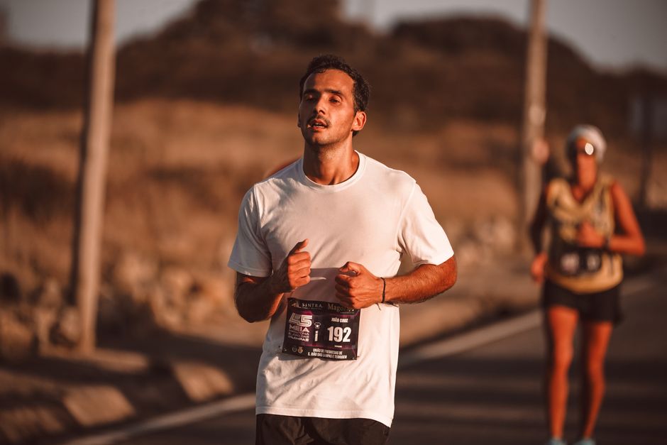 Runner crossing the finish line after an intense marathon effort