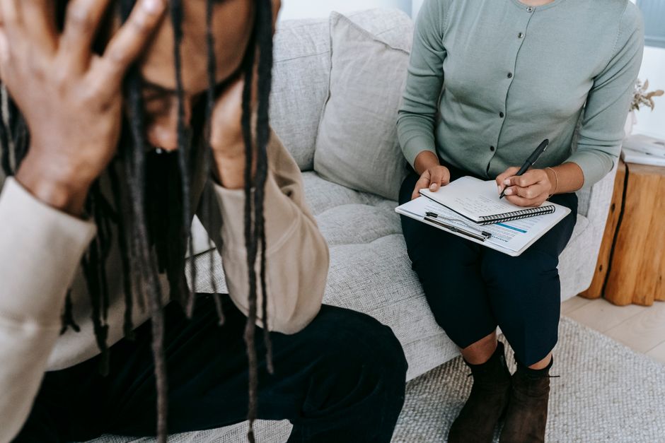 Therapist supporting an adult during exposure therapy