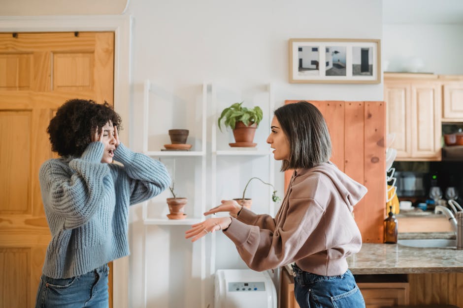 Person looking defensive and frustrated during a difficult conversation