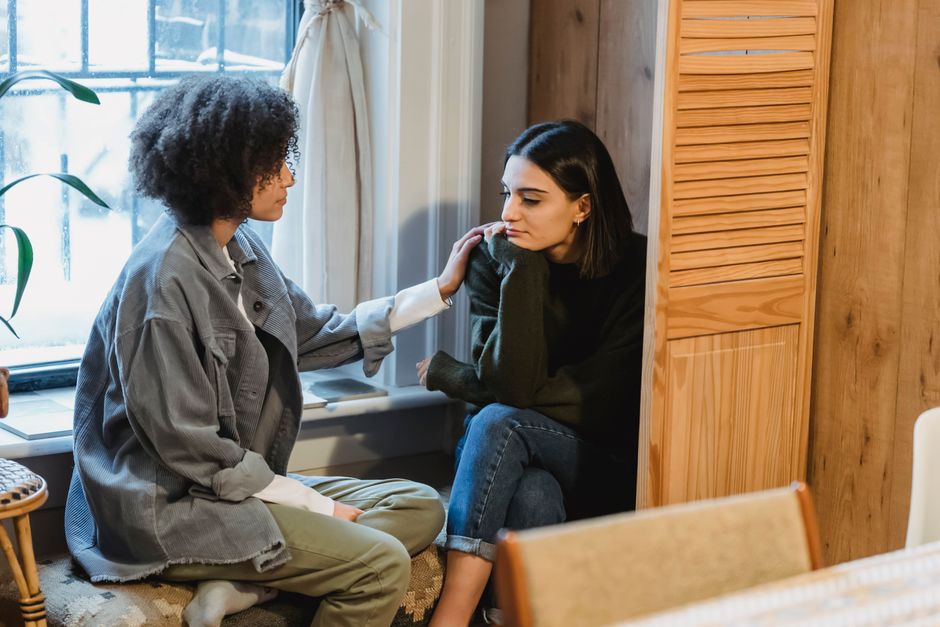 Person listening attentively during a conversation, showing active listening