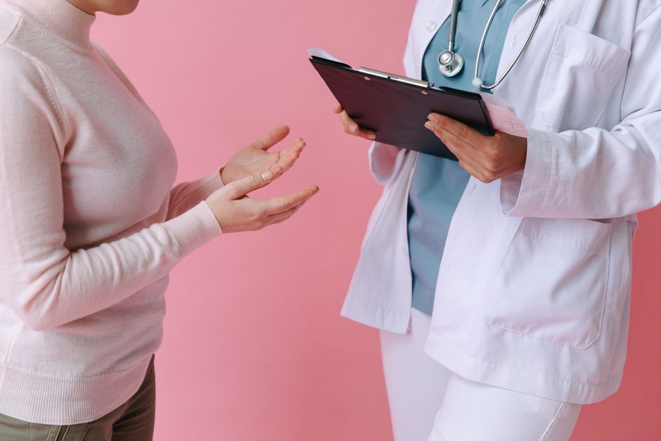 Doctor and patient in consultation discussing medical treatment options