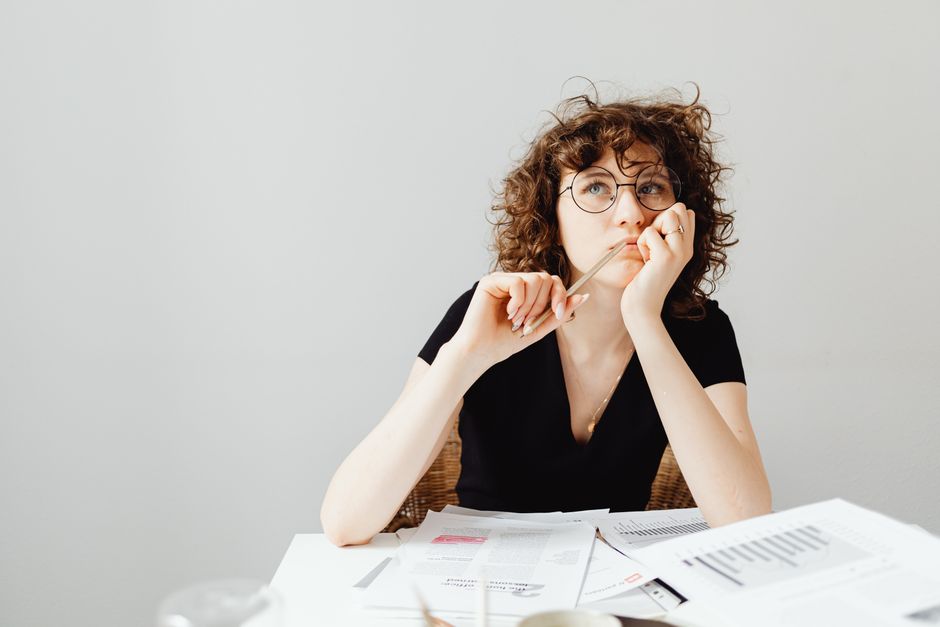 Person reading notes about cognitive biases and decision-making