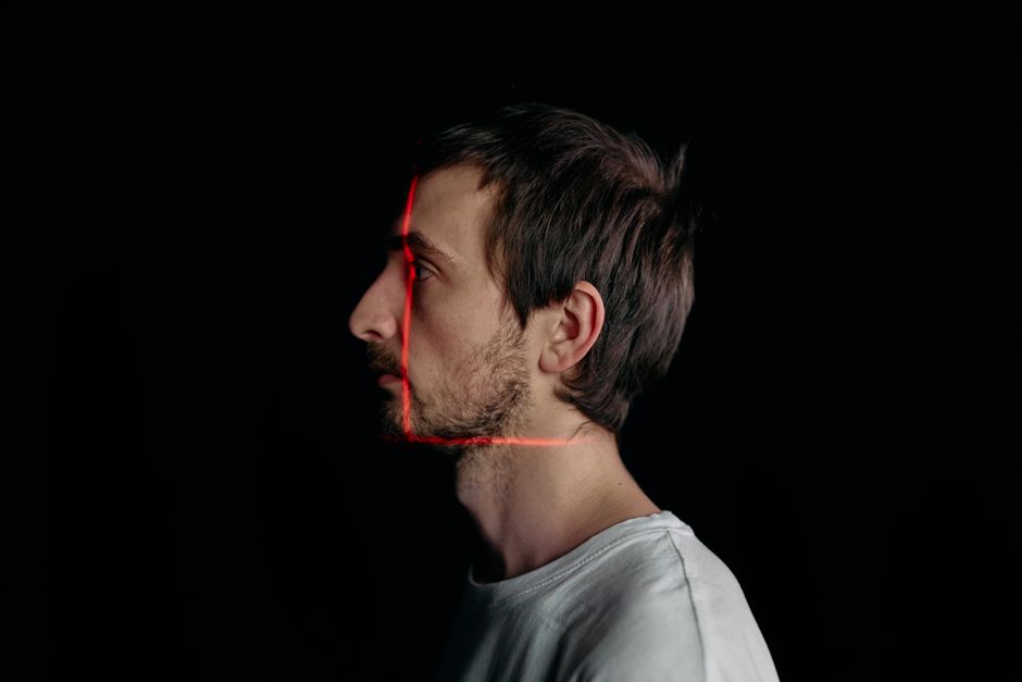Person scanning a crowded environment with heightened alertness