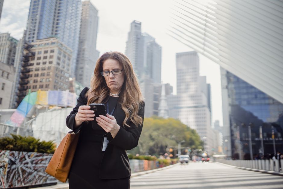 Person checking phone repeatedly for reassurance and messages