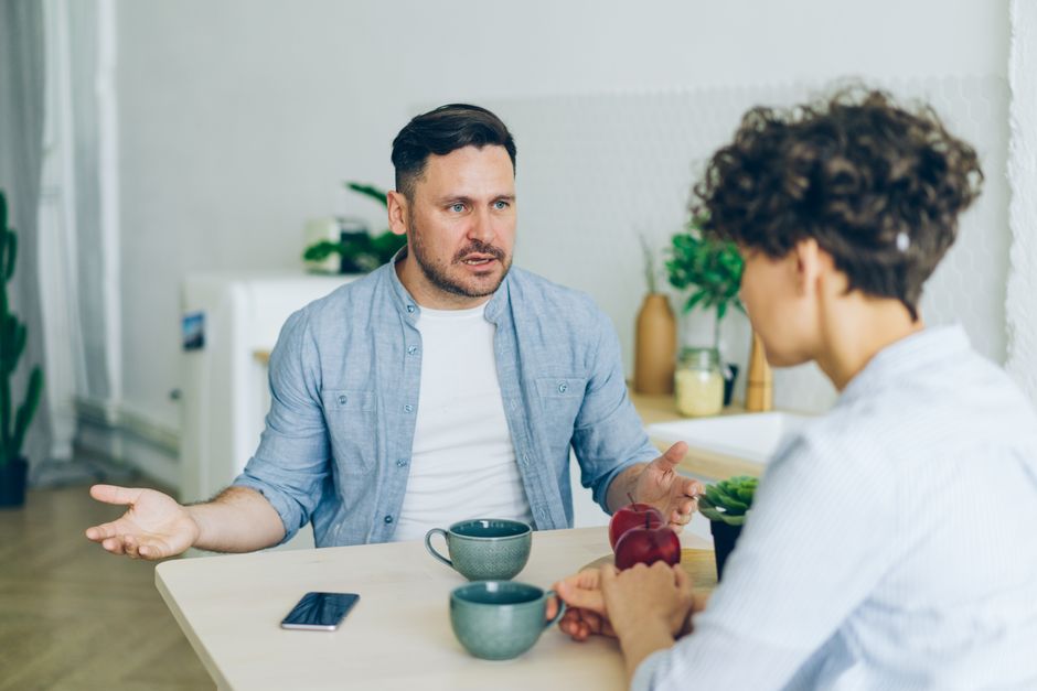 Two people talking seriously about expectations and emotions