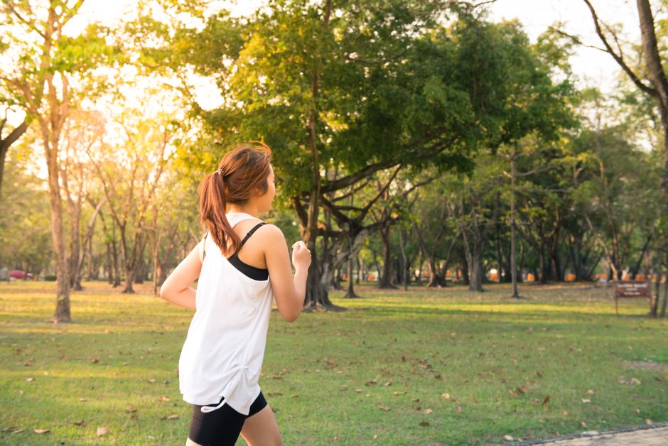 Person running outdoors at sunrise for brain health
