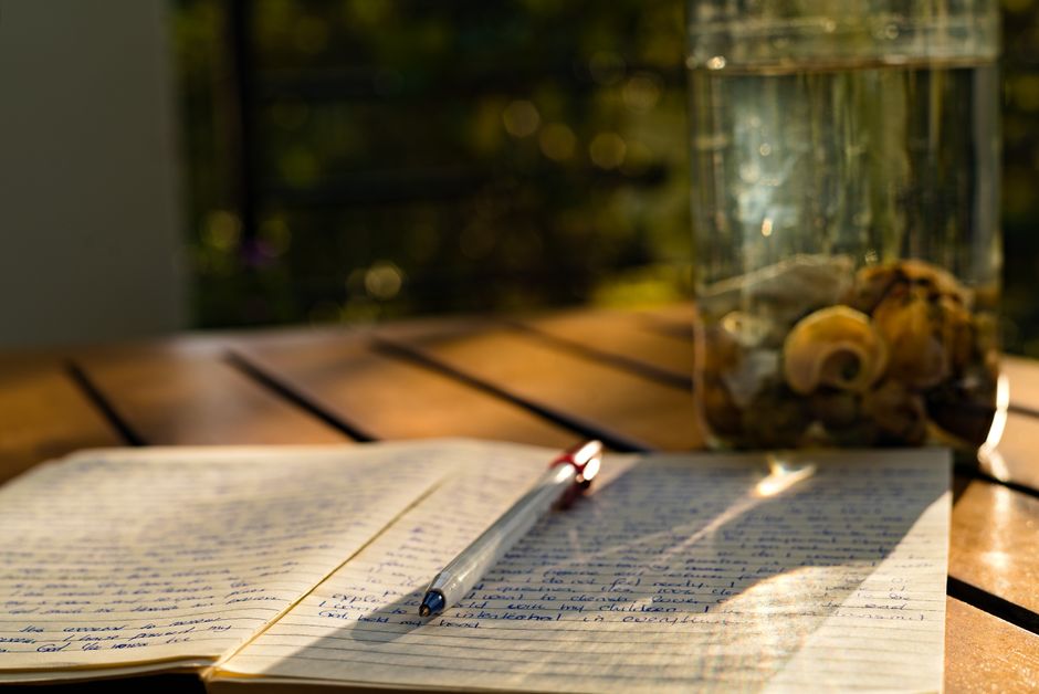 Notebook with gratitude journal and pen on a table