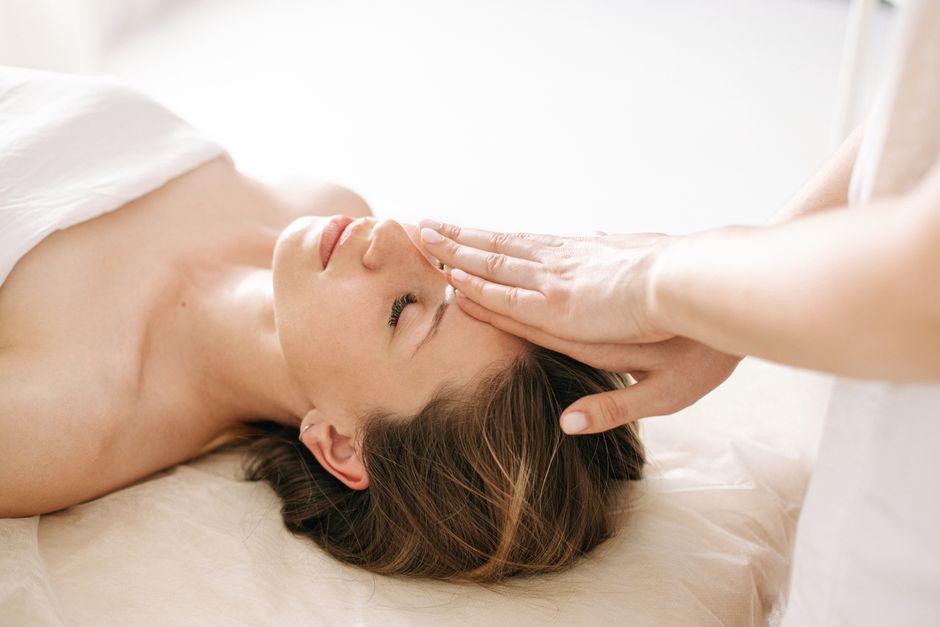 Person tapping on face and upper body during an EFT session