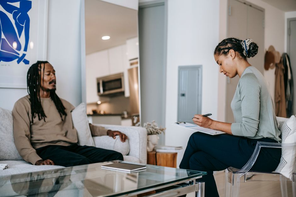 Therapist talking with a patient in a counseling session
