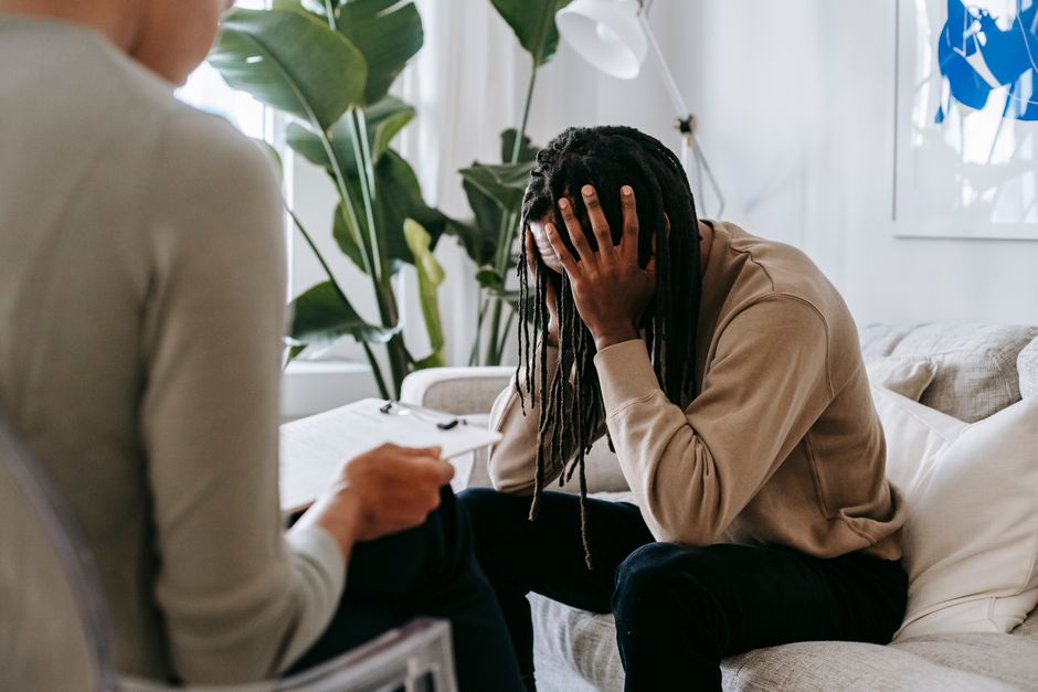 Therapy session with psychologist and patient discussing anxiety