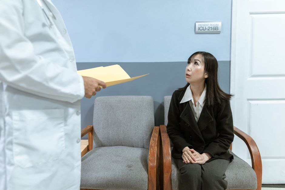 Person preparing for a dental appointment feeling anxious in a clinic waiting room