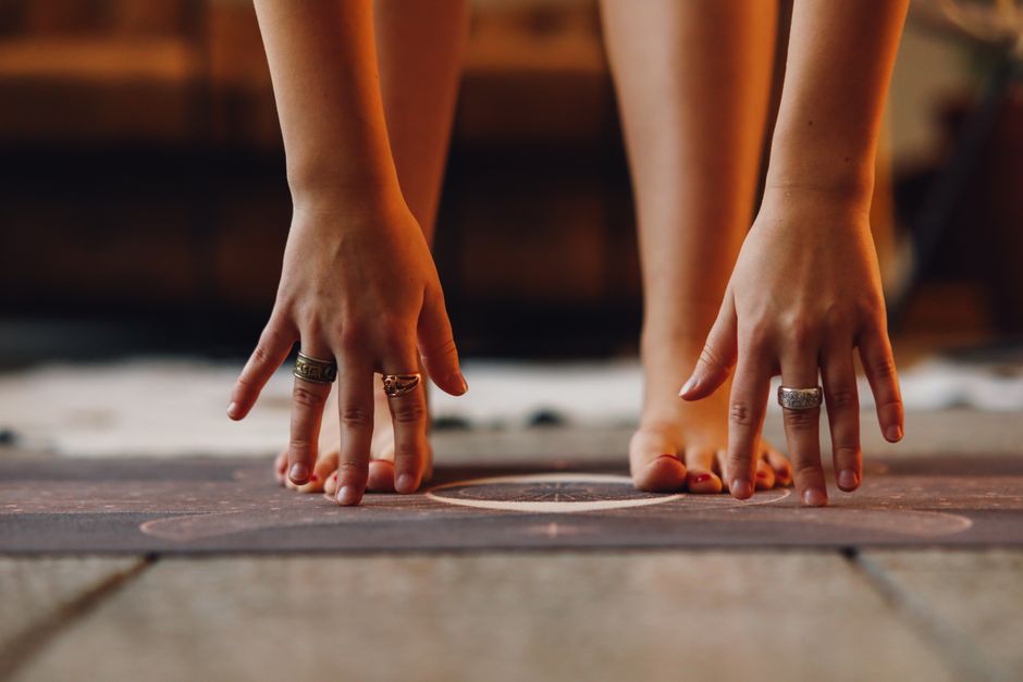 Close-up of hands grounding on a textured surface for mindfulness
