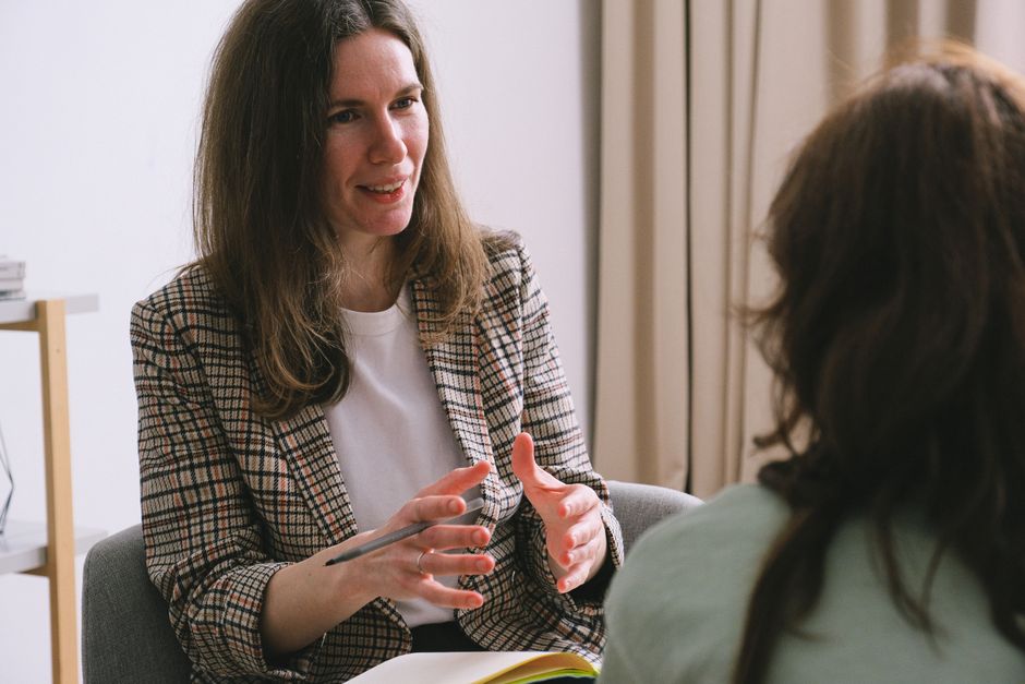 Person in a reflective consultation with a mental health professional