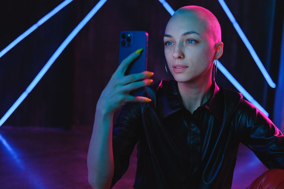 Woman looking at phone with anxiety, digital surveillance and control