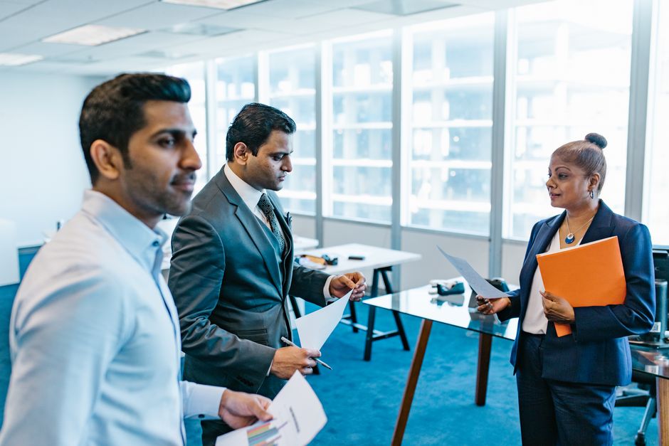 Team discussion in a workplace meeting about personality and roles