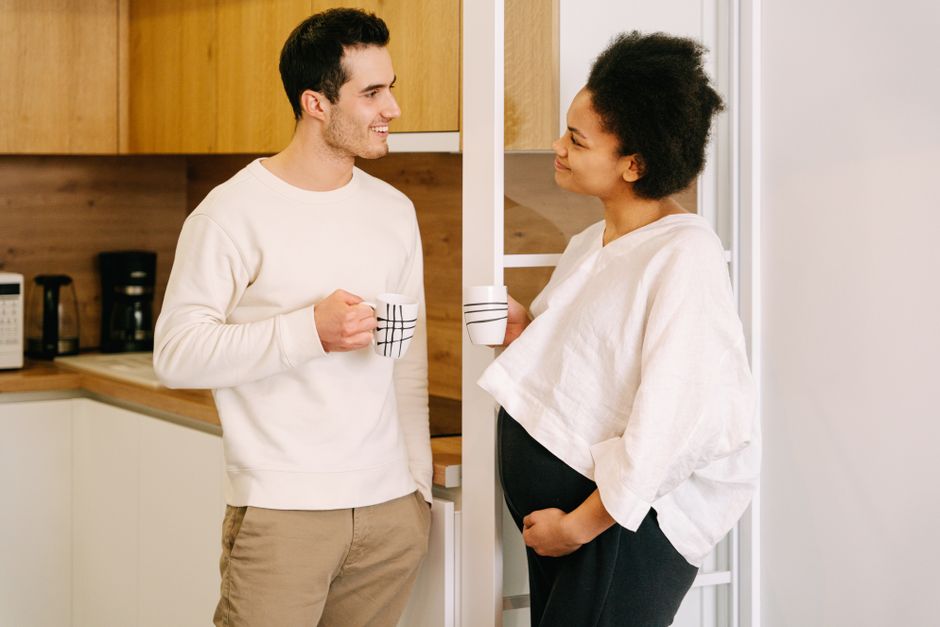 Couple discussing intimacy and consent in a calm, private setting